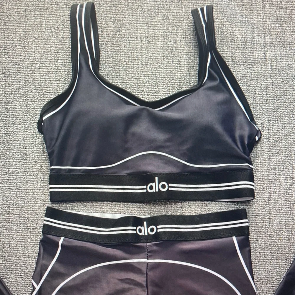 ALO Yoga Black Leggings with White Piping Detail